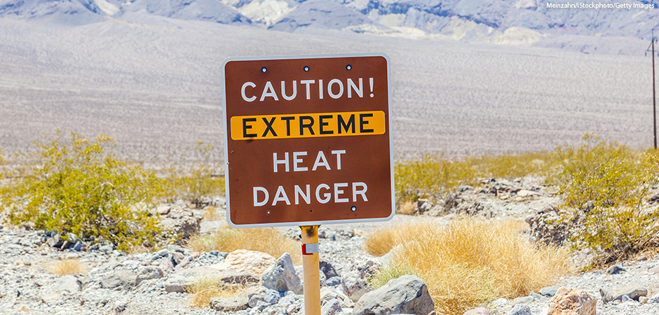 A road sign in Death Valley warning travelers of Caution Extreme Heat Danger