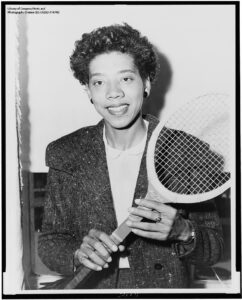 1956 photo of Althea Gibson holding tennis racquet