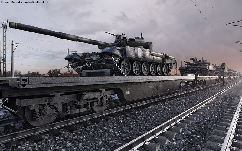 photo of tanks on a train car being transported on railway