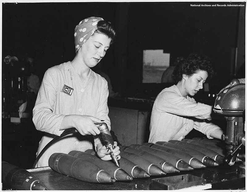 black and white historic image of women working at the munitions factory in 1944