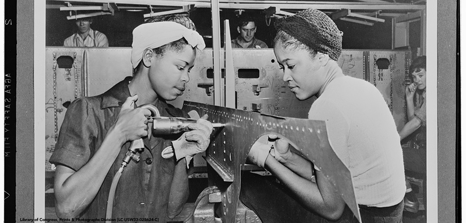 black and white historic photo of women working on a assembly line at the El Segundo Plant of the Douglas Aircraft Company