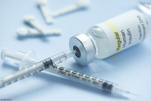 Syringe draws insulin from regular vial with lancets