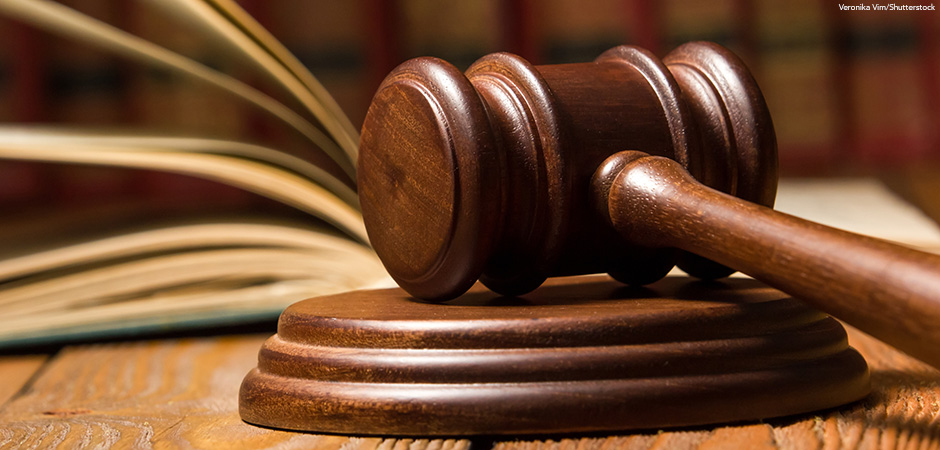 Mallet gavel of the judge, scales of justice, books.