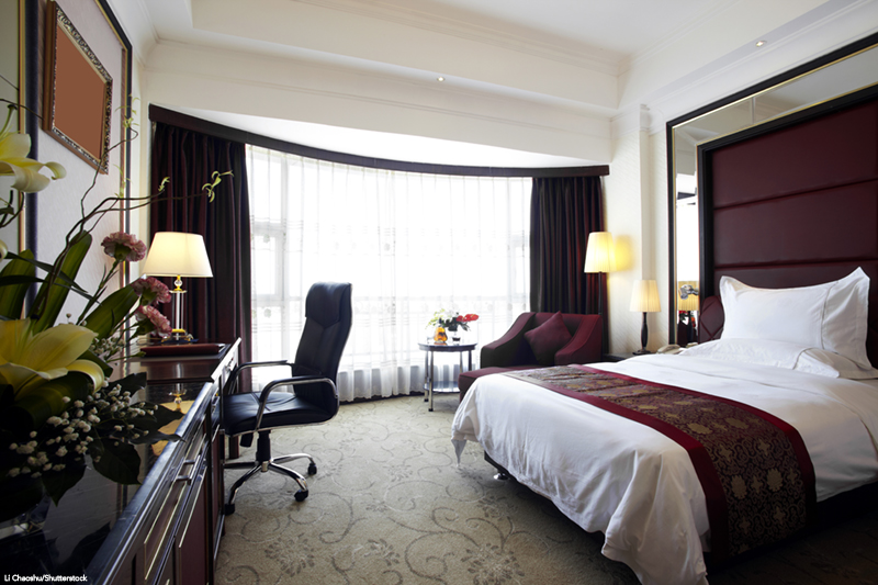 Interior view of a luxury hotel bedroom