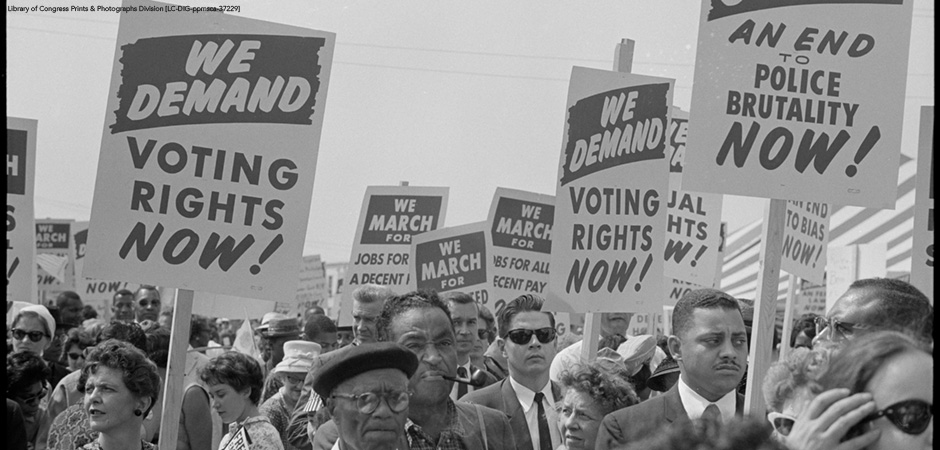 Marchers with signs at the March on Washington, 1963