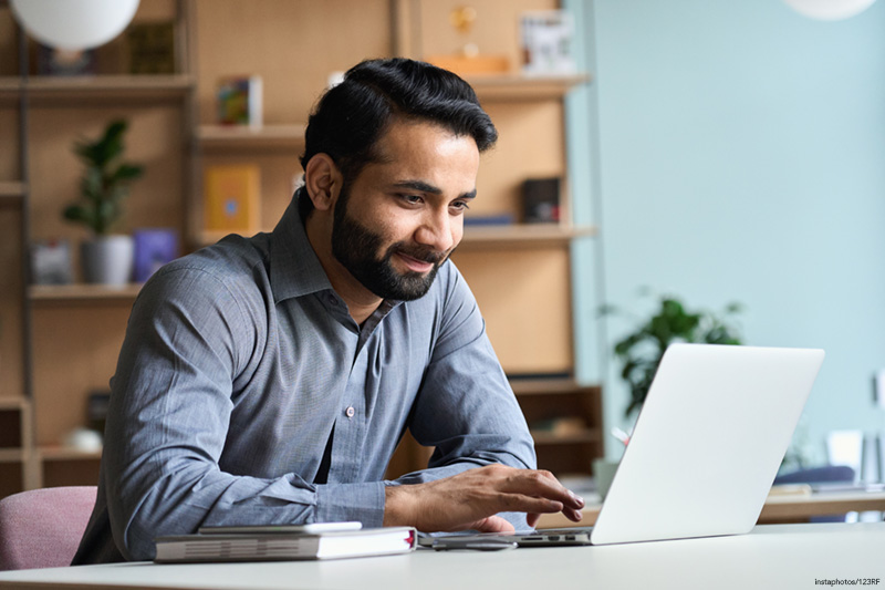 business man working on laptop at home office