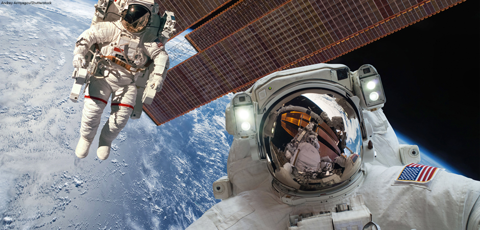 International Space Station and astronaut in outer space over the planet Earth.