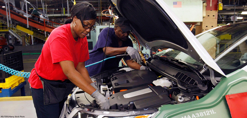 United Auto Workers union member assembly workers work on a Chevrolet Volt electric vehicle at General Motors Detroit-Hamtramck assembly plant in Hamtramck, Michigan July 27, 2011. REUTERS/Rebecca Cook (UNITED STATES - Tags: TRANSPORT BUSINESS EMPLOYME United Auto Workers union member assembly workers work on a Chevrolet Volt electric vehicle.