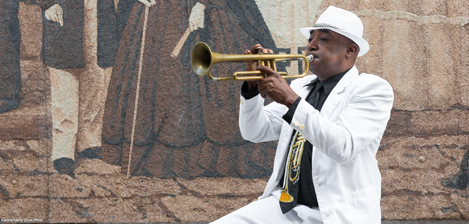 Cuban musician playing the trumpet in Havana