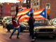 Hundreds of cars form a caravan in the Humboldt Park neighborhood to express Puerto Rican pride