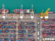 commercial port loading and unloading cargo from container ship