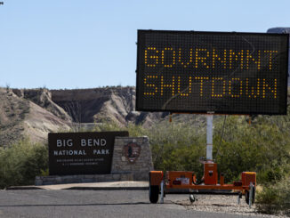 Roadside sign warning of a government shutdown.