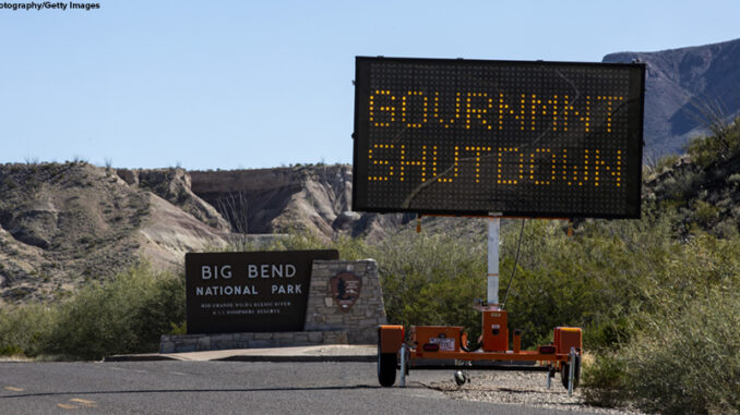 Roadside sign warning of a government shutdown.