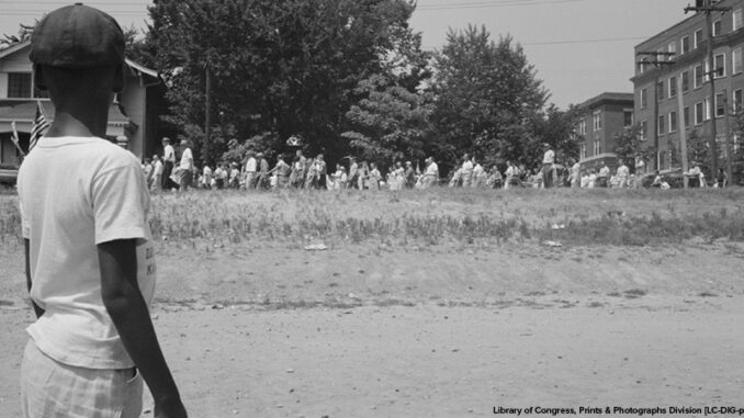 People marching from the Little Rock, Arkansas capitol to Central High School in 1959.