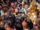 Buddha statue being carried in the water ceremony at a Songkran festival.