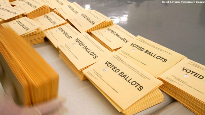 Absentee ballots being sorted and prepared for recording at the Ada County Elections building in Boise, Idaho.